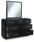 Rowanbeck California King Upholstered Panel Bed with Mirrored Dresser