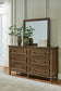 Sturlayne California King Upholstered Panel Bed, Dresser, Mirror and Nightstand