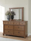Rowlenstown California King Poster Bed with Mirrored Dresser